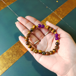Stretchable bracelet made with lab certified 8mm Tiger Eye and Amethyst gemstone beads, ideal for meditation and daily wear
