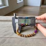 Stretchable bracelet made with lab certified 8mm Tiger Eye and Amethyst gemstone beads, ideal for meditation and daily wear