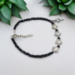 Stylish black crystal beads anklet featuring both Evil Eye and Tortoise charms, designed for unisex wear and spiritual protection
