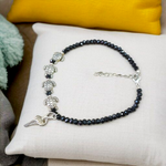 Stylish black crystal beads anklet featuring both Evil Eye and Tortoise charms, designed for unisex wear and spiritual protection