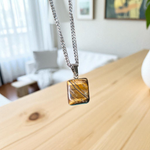 Tiger Eye Pendant with stainless steel chain for men and women – polished oval stone in elegant setting, lab certified