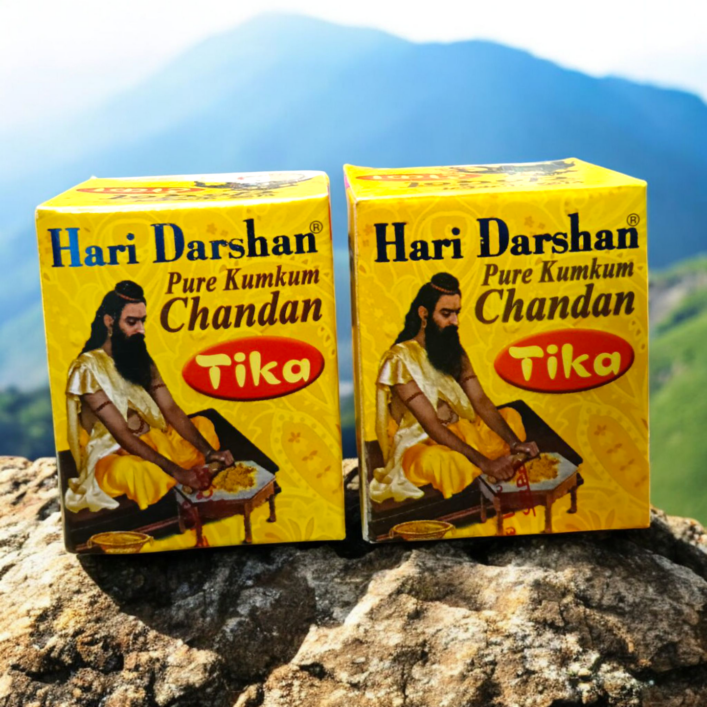 Two plastic containers of Hari Darshan Kumkum and Chandan Tilak with vibrant red and beige paste used for religious markings