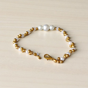 White and golden pearl bracelet with alternating beads, beautifully handcrafted for girls and women, perfect for festive and daily wear