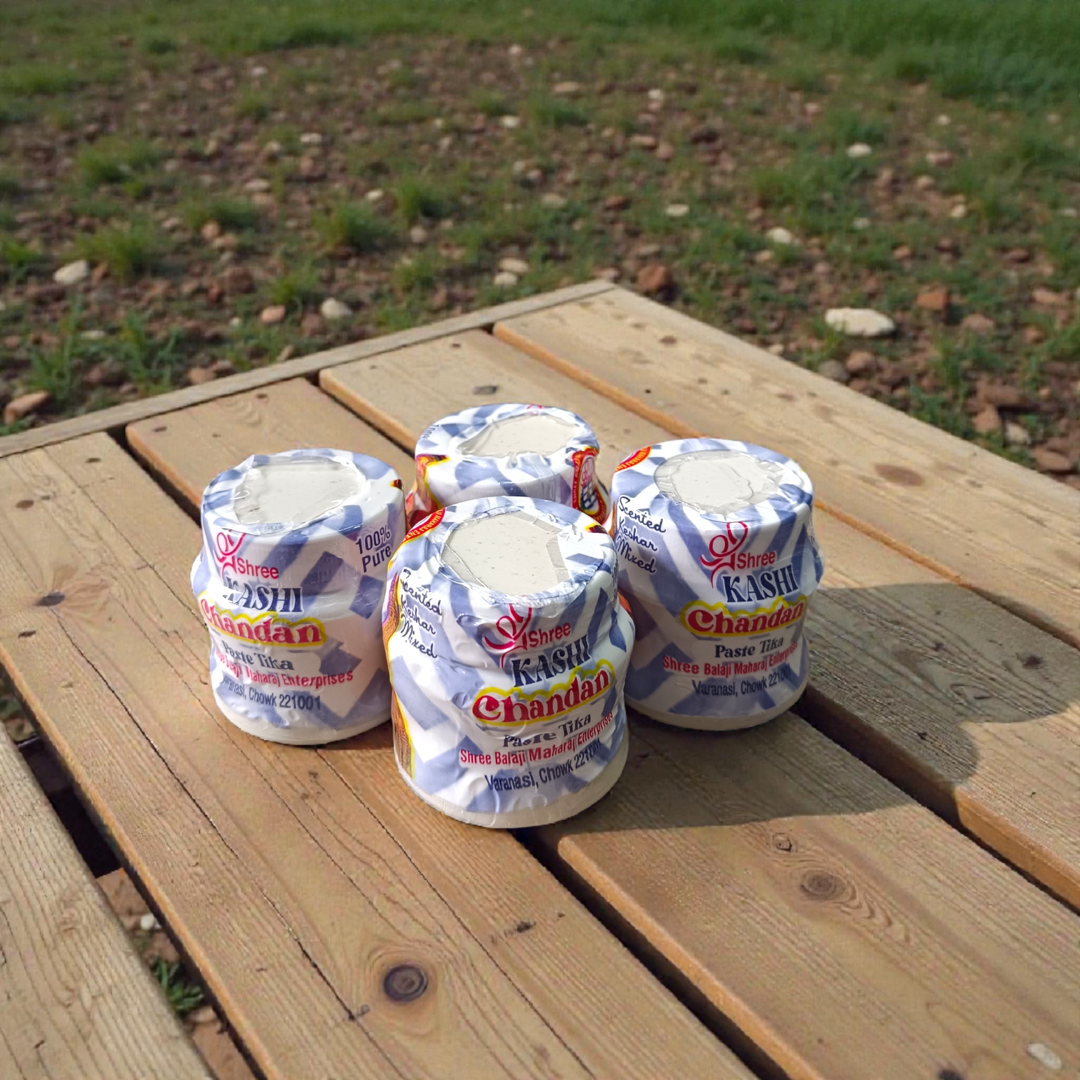 White chandan paste container used for tilak, puja, and religious ceremonies