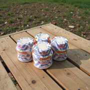 White chandan paste container used for tilak, puja, and religious ceremonies