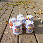 White chandan paste container used for tilak, puja, and religious ceremonies