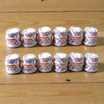 White chandan paste container used for tilak, puja, and religious ceremonies