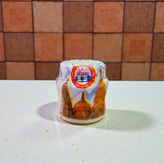 White chandan paste container used for tilak, puja, and religious ceremonies