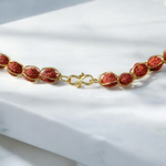 Wired Rudraksha Mala featuring 5mm Rudraksha beads wrapped in golden wire, neatly handcrafted and ideal for meditation or daily wear