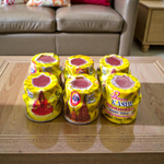 Yellow chandan paste container used for tilak, puja, and religious rituals