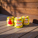 Yellow chandan paste container used for tilak, puja, and religious rituals