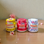 Yellow, red, and white chandan paste containers used for tilak, puja, and religious rituals