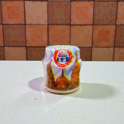 Yellow, red, and white chandan paste containers used for tilak, puja, and religious rituals